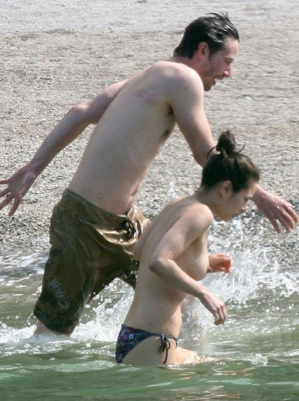 China Chow Goes Topless At The Beach Photos 17