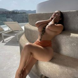 Demi Rose Enjoys a Sunny Day Topless 1 Photo