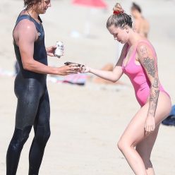Ireland Baldwin Flaunts Sexy Legs and Flashes Tattoos in a Pink Swimsuit 11 Photos