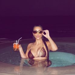 Kim Kardashian Poses in the Pool 3 Photos