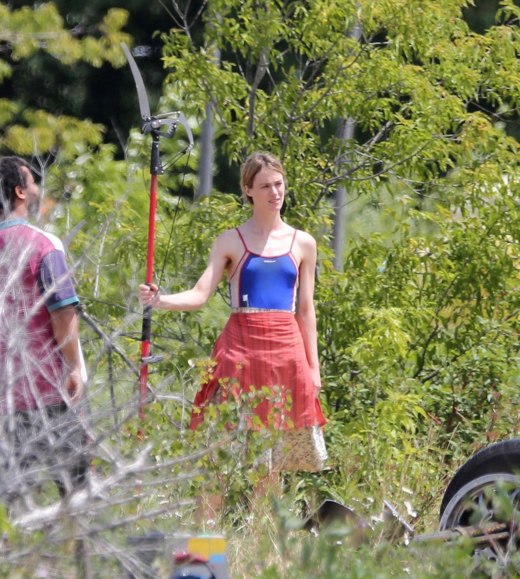 Mackenzie Davis Holds a Tree Pruner Saw Blade on set Filming Station Eleven’ in Toronto (33 Photos)