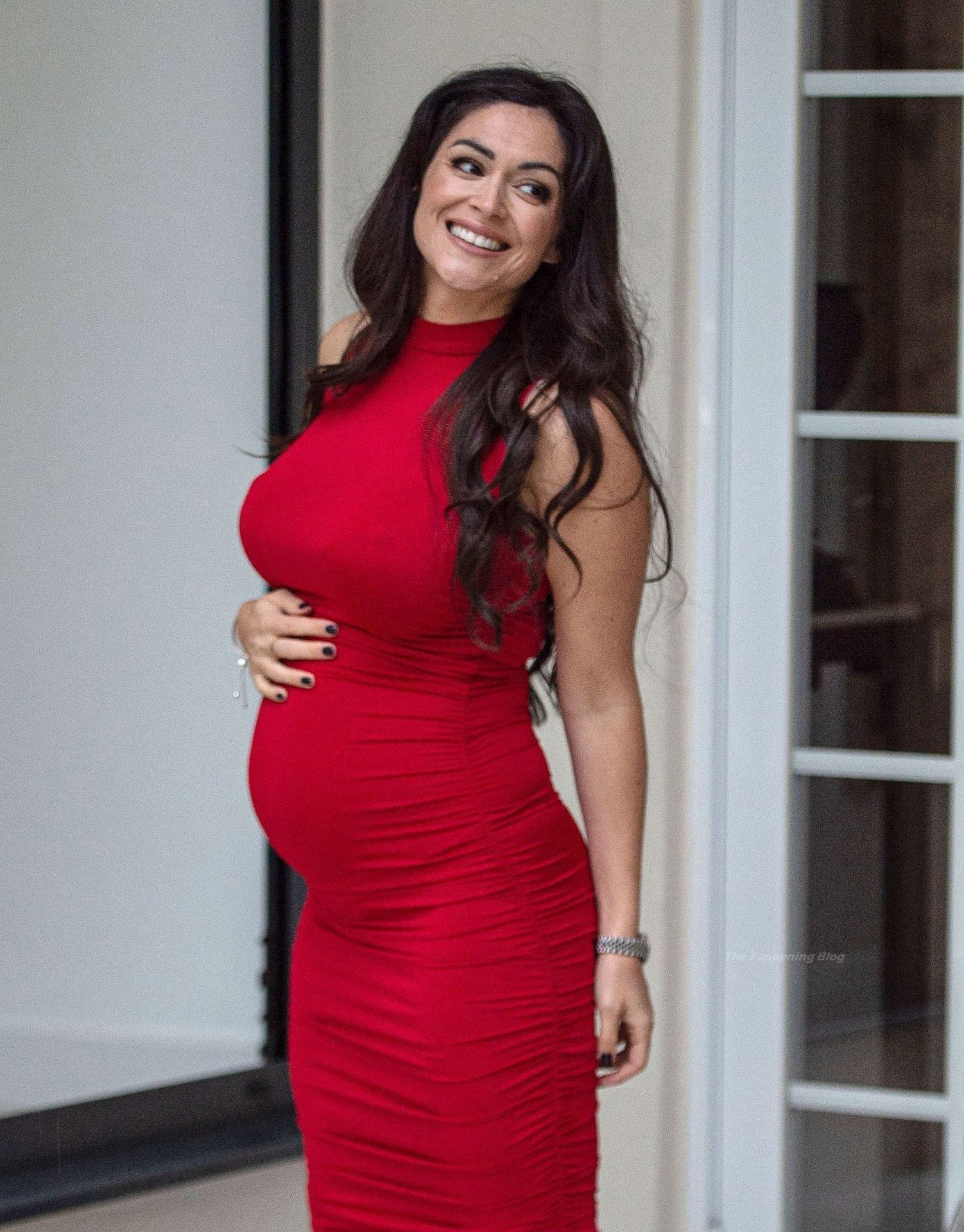 Casey Batchelor Shows Off Her Baby Bump in a Red Dress (14 Photos)
