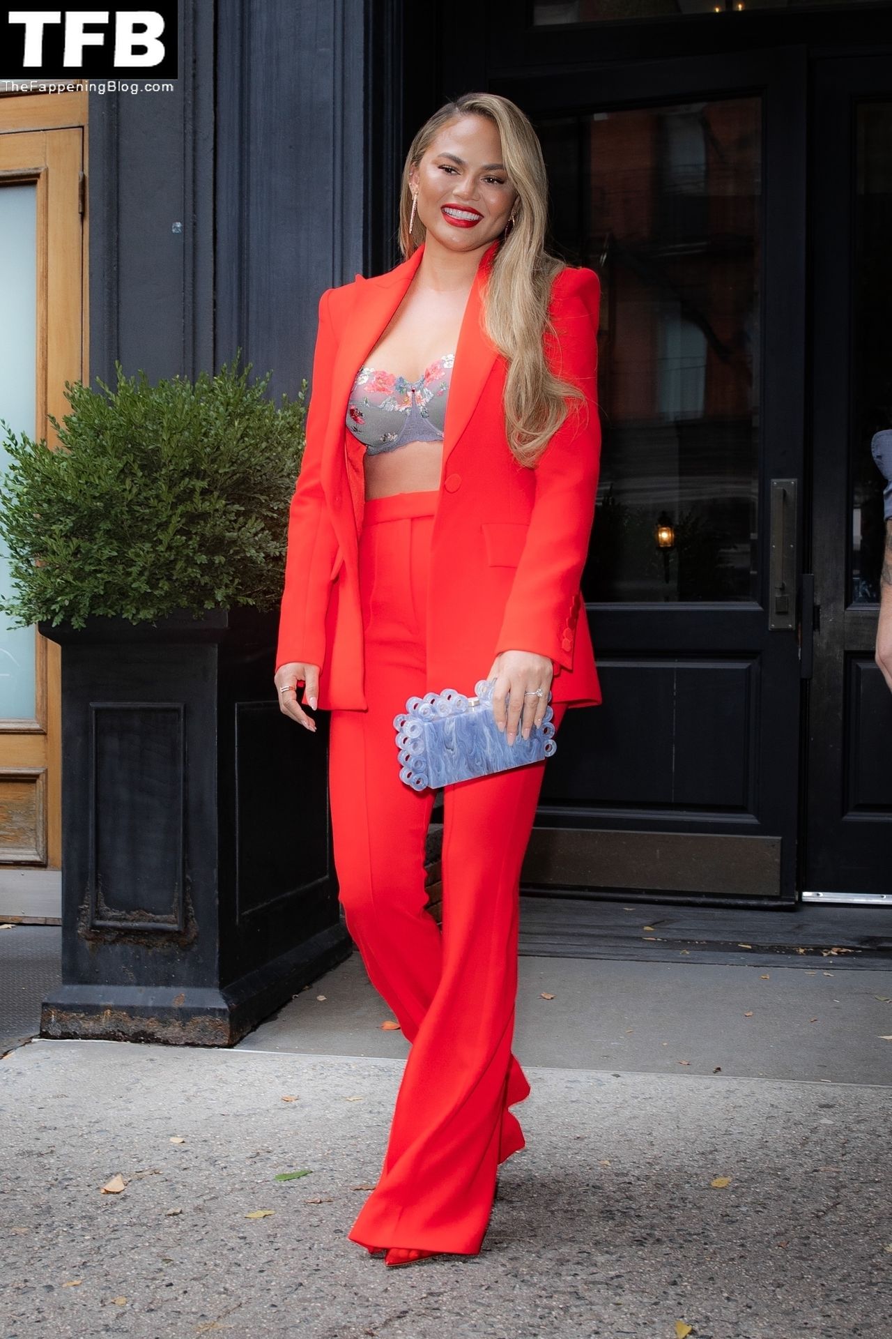 Chrissy Teigen Looks Hot in Red as she Heads to The Wendy Williams Show in NYC (10 Photos)