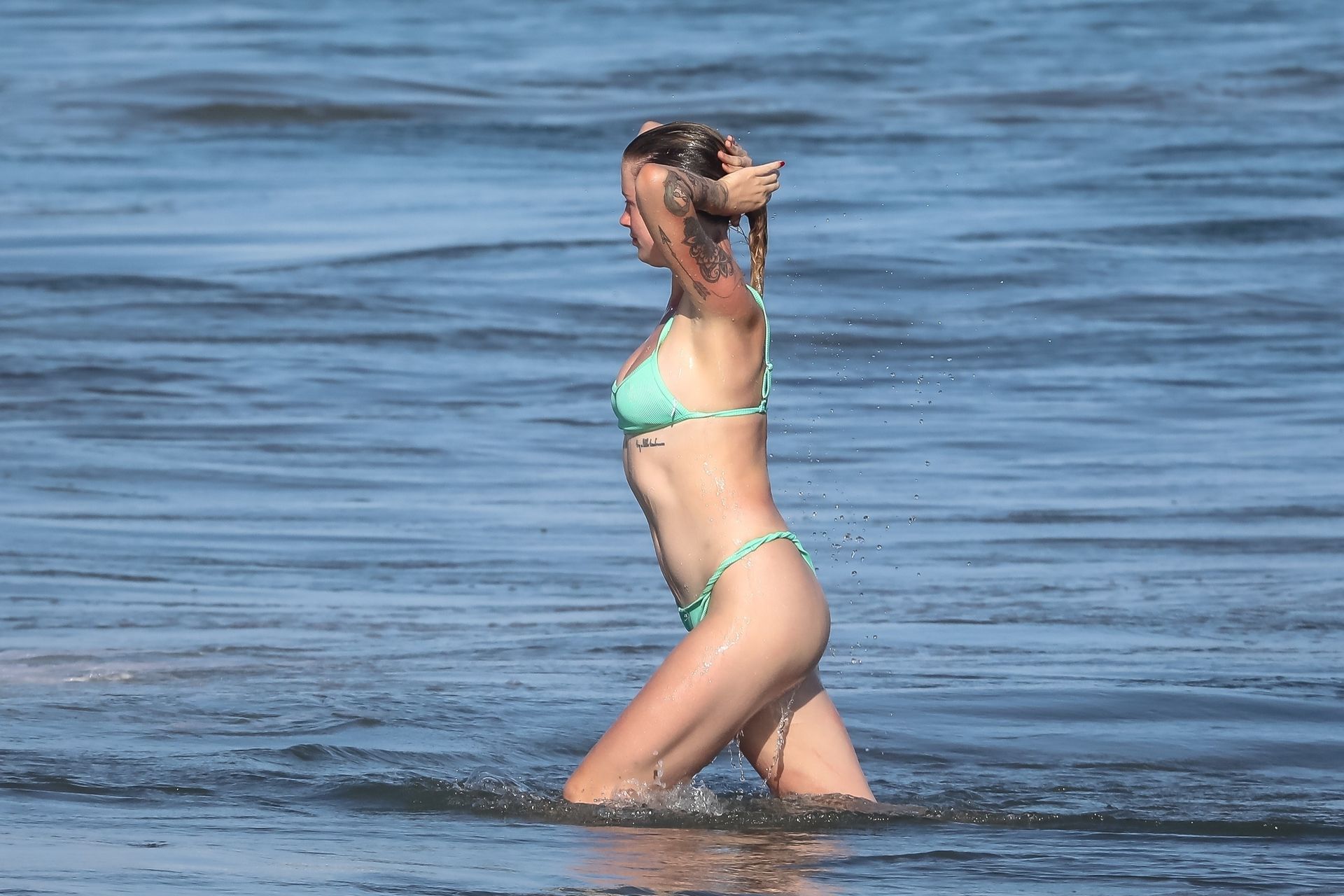Ireland Baldwin Goes For a Dip Splash While Enjoying a Beach Day (4 Photos)