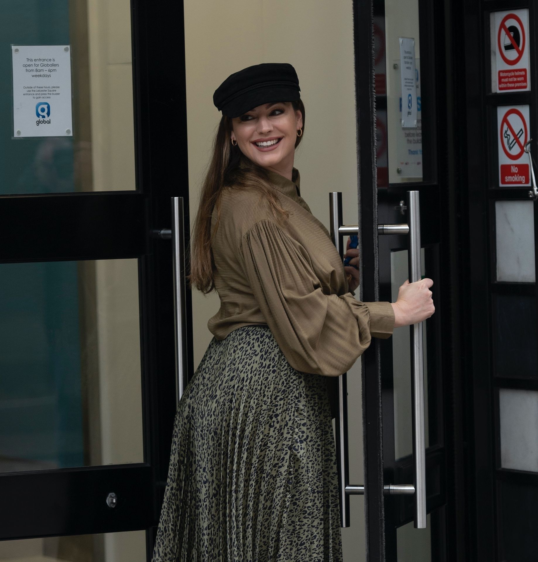 Kelly Brook Arrives at Heart Radio in a Busty Blouse and Pleated Skirt (65 Photos)