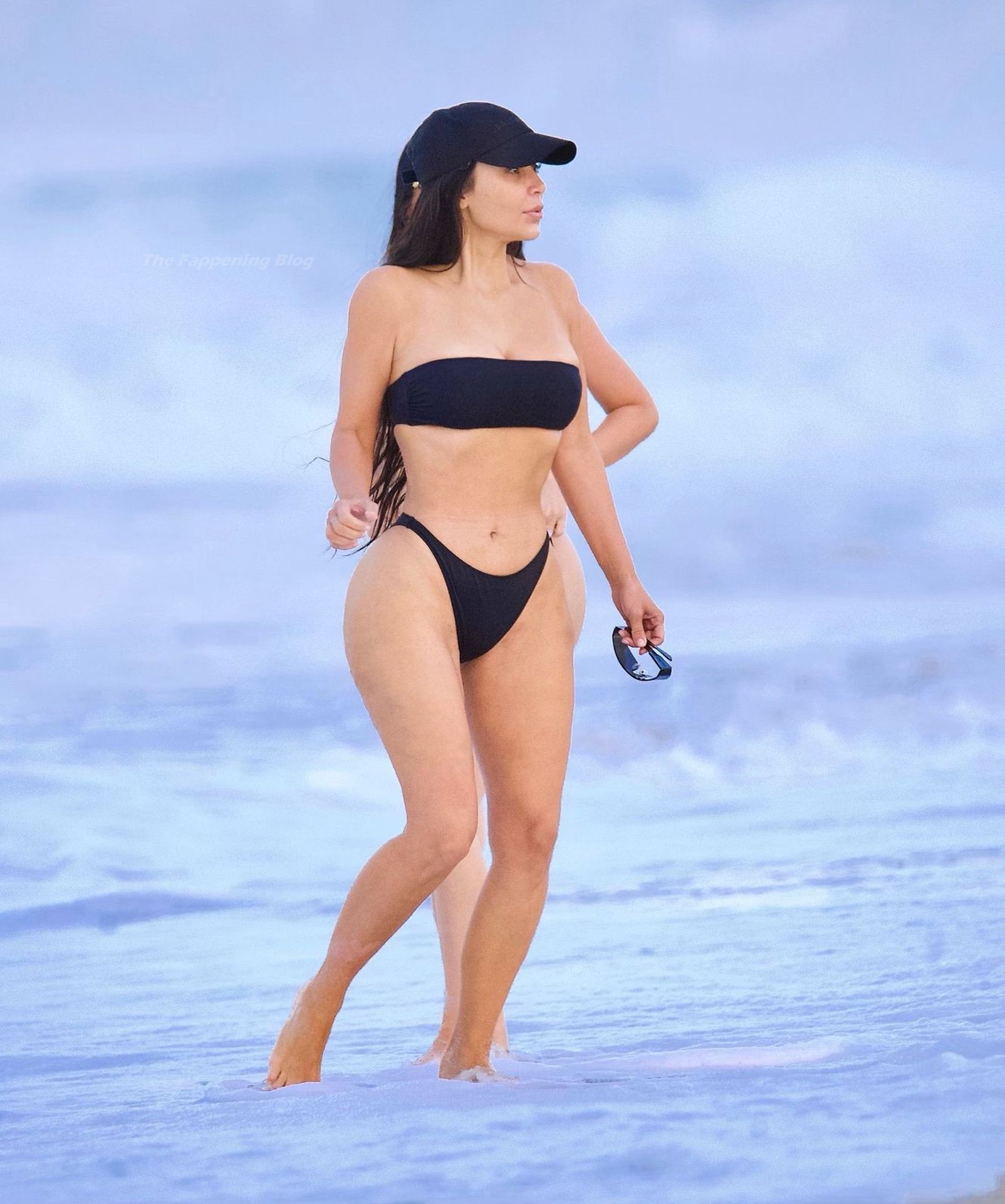 Kim Kardashian Flaunts Her Curves on The Beach (17 Photos)