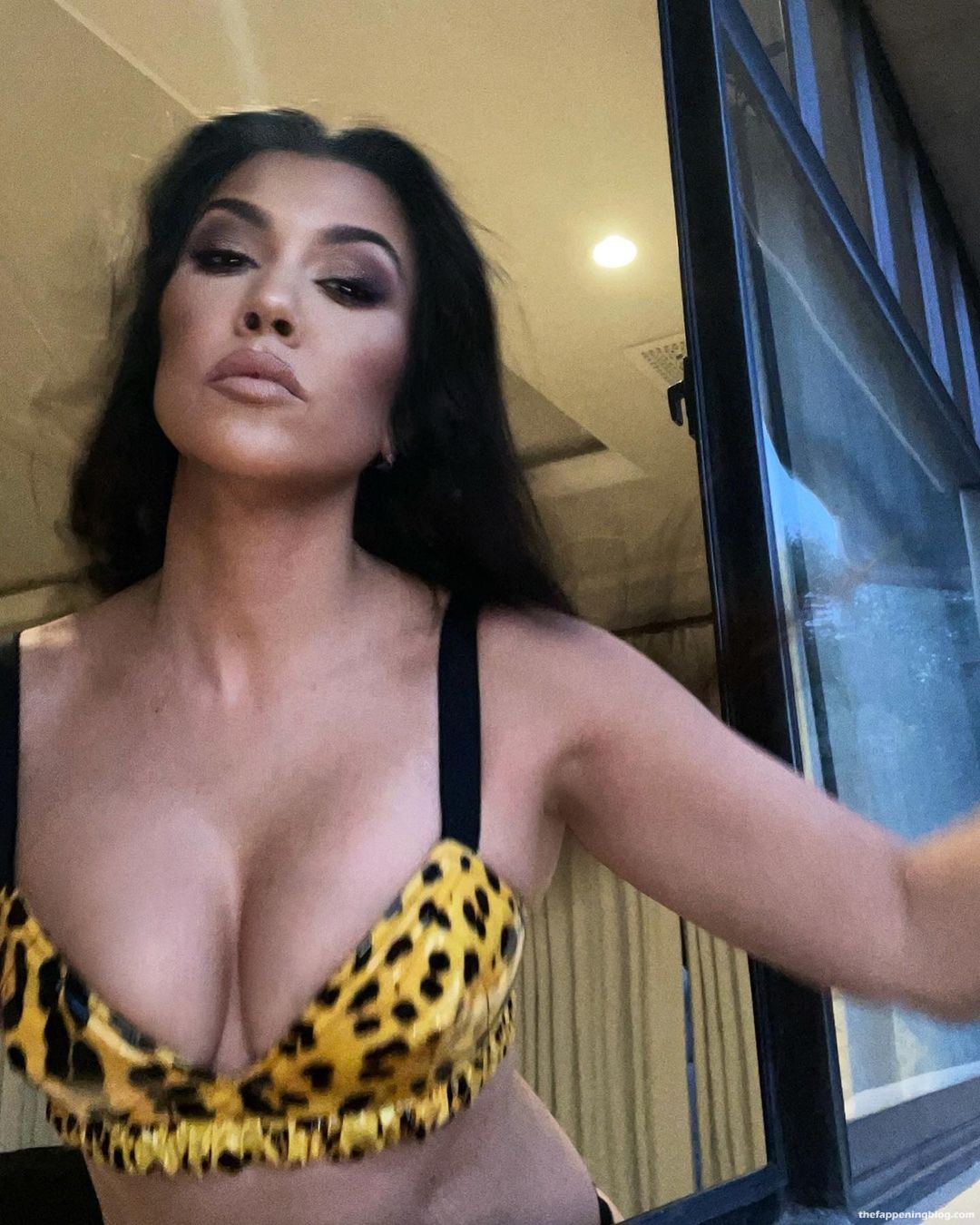 Kourtney Kardashian Flaunts Her Tits (10 Photos)