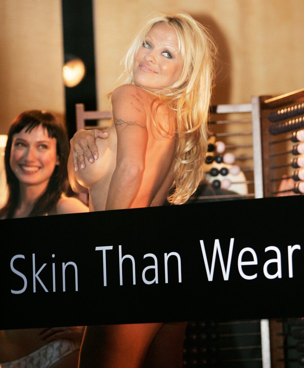 Pamela Anderson Topless (11 Photos + Video)