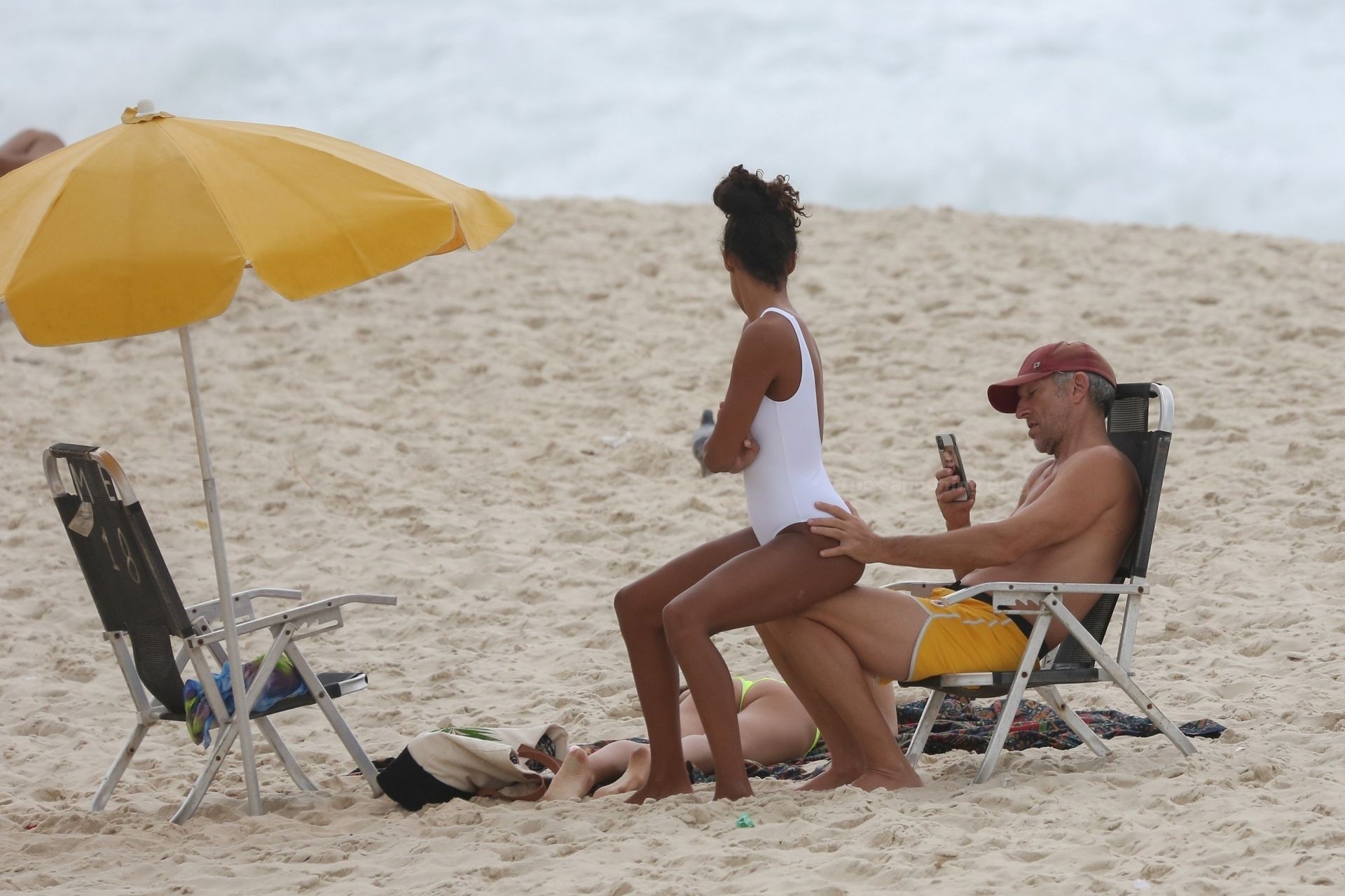 Vincent Cassel & Tina Kunakey Enjoy a Beach Day in Rio De Janeiro (22 Photos)